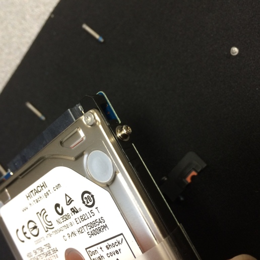 7. Remove the small torx screws on the drive.